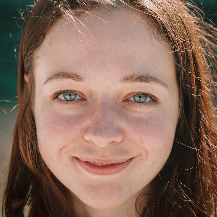 Kaveri Mehta, Lead Design Curator at PaperHarborCrest, reviewing corporate floral arrangements